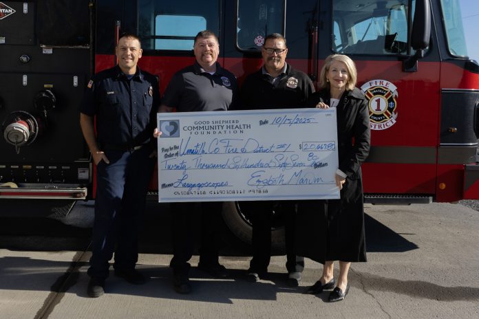 Liz Marvin, Executive Director of the Good Shepherd Community Health Foundation, presents a check to UCFD1. Photo courtesy of UCFD1