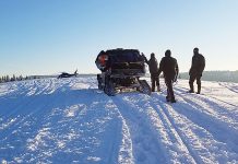 Man Rescued After Snowmobile Crashes on Top of Him