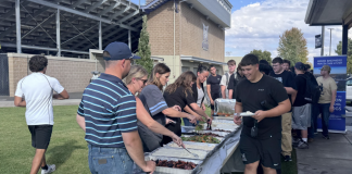 Forks and first downs: Hermiston Football enjoys team meal before kicking off season with win